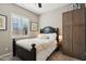 Comfortable bedroom featuring soft carpet, side tables with lamps, and custom blinds at 3163 E Austin Dr, Gilbert, AZ 85296