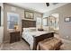 Comfortable primary bedroom with ample natural light, an archway leading to the bathroom at 3163 E Austin Dr, Gilbert, AZ 85296