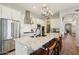 Gourmet kitchen with stainless steel appliances, granite countertops, and large island with seating at 3163 E Austin Dr, Gilbert, AZ 85296