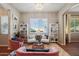 Bright living room featuring plush seating, decorative bookshelves, and an inviting atmosphere at 3163 E Austin Dr, Gilbert, AZ 85296