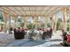 This patio has seating, a rug, and a pergola with curtains at 3163 E Austin Dr, Gilbert, AZ 85296