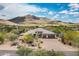 Expansive aerial view of desert home showcasing mountain views, privacy, desert landscaping and inviting curb appeal at 35971 N Prickley Pear Rd, Cave Creek, AZ 85331