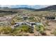 Expansive desert estate with a pool, patio, and mountain views, showcasing solar panels and spacious grounds at 35971 N Prickley Pear Rd, Cave Creek, AZ 85331