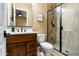 Bathroom featuring a modern vanity, stylish shower with glass doors, and neutral color palette at 35971 N Prickley Pear Rd, Cave Creek, AZ 85331