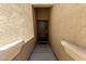 Inviting front entryway with a dark-stained door at 36454 W Picasso St, Maricopa, AZ 85138