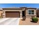 Beautiful single-story home featuring a two car garage and a well-maintained xeriscaped front yard at 36454 W Picasso St, Maricopa, AZ 85138