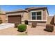 Well-maintained single-story home featuring a two car garage and a xeriscaped front yard at 36454 W Picasso St, Maricopa, AZ 85138