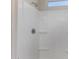 Shower featuring white shower walls, chrome fixtures, and recessed lighting at 36454 W Picasso St, Maricopa, AZ 85138
