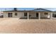 Backyard with gravel and a covered patio with an outdoor cooking station at 3752 W Becker Ln, Phoenix, AZ 85029