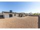 Spacious backyard featuring gravel, a covered patio, and an outdoor grill at 3752 W Becker Ln, Phoenix, AZ 85029