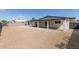 Spacious backyard featuring gravel, a covered patio, and an outdoor cooking station at 3752 W Becker Ln, Phoenix, AZ 85029