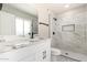 Stylish bathroom featuring marble counters, black fixtures, and tiled shower at 3752 W Becker Ln, Phoenix, AZ 85029