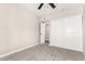 Bedroom featuring carpeted floors, ceiling fan, and closet with sliding doors at 3752 W Becker Ln, Phoenix, AZ 85029