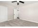 Bedroom with neutral color scheme, carpet, white door, and ceiling fan at 3752 W Becker Ln, Phoenix, AZ 85029