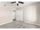 Neutral bedroom featuring grey carpet, white walls, and a double door closet at 3752 W Becker Ln, Phoenix, AZ 85029