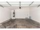 Clean garage space with white walls, concrete floor, and water heater at 3752 W Becker Ln, Phoenix, AZ 85029