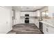 Modern kitchen featuring white cabinets, stainless steel appliances, and marble countertops at 3752 W Becker Ln, Phoenix, AZ 85029