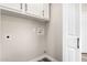 Laundry area with cabinets, utility hookups, and light grey walls at 3752 W Becker Ln, Phoenix, AZ 85029