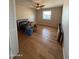 Bedroom with a ceiling fan, hardwood floors, and a window to allow for lots of natural light at 3914 E Andorra Dr, Phoenix, AZ 85032