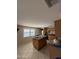Kitchen featuring an island with granite countertops, tile floors, and a stainless-steel refrigerator at 3914 E Andorra Dr, Phoenix, AZ 85032