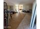 An empty living room featuring tile and hardwood floors and access to additional rooms at 3914 E Andorra Dr, Phoenix, AZ 85032