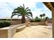 Spacious backyard featuring desert landscaping, a mature palm tree and a cozy patio at 4081 N 156Th Dr, Goodyear, AZ 85395