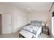 Cozy bedroom with a comfortable bed, side tables, and a sliding door closet at 4081 N 156Th Dr, Goodyear, AZ 85395