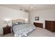Relaxing bedroom featuring a bed, nightstands, and dressers for ample storage at 4081 N 156Th Dr, Goodyear, AZ 85395