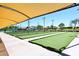 Well-maintained bocce ball courts with sun shade, offering a fun recreational activity for residents at 4081 N 156Th Dr, Goodyear, AZ 85395