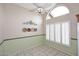 Cozy dining area with tile flooring, plantation shutters, and a modern ceiling fan at 4081 N 156Th Dr, Goodyear, AZ 85395
