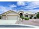 Charming single-story home boasts a three-car garage and well-maintained desert landscaping at 4081 N 156Th Dr, Goodyear, AZ 85395