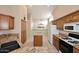 Bright kitchen featuring granite countertops, a center island, and modern appliances at 4081 N 156Th Dr, Goodyear, AZ 85395