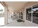 Covered patio with outdoor seating and elegant columns, perfect for enjoying the serene backyard views at 4081 N 156Th Dr, Goodyear, AZ 85395