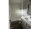Bright bathroom featuring a walk-in shower with elegant marble tile surround and a modern vanity with sleek hardware at 5211 W Beryl Ave, Glendale, AZ 85302