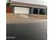 Ranch-style home features a two-car garage, neutral color palette, and low maintenance landscaping at 5211 W Beryl Ave, Glendale, AZ 85302