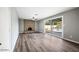 Spacious living room includes brick fireplace and sliding glass door to pool area at 5211 W Beryl Ave, Glendale, AZ 85302