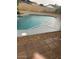 Backyard pool with concrete decking and rock landscaping is perfect for relaxing and entertaining at 5211 W Beryl Ave, Glendale, AZ 85302