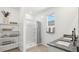 Well-lit bathroom featuring a single vanity with granite counters and a shower and tub combo at 5812 E Freesia Ln, San Tan Valley, AZ 85140