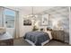 Charming bedroom showcases a decorative chandelier, cloud wallpaper, and a unicorn art piece at 5812 E Freesia Ln, San Tan Valley, AZ 85140