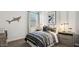 bedroom with decorative shark art, and bedside tables with lamps at 5812 E Freesia Ln, San Tan Valley, AZ 85140