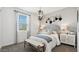Inviting bedroom with decorative lighting, a bench seat, and stylish wall décor at 5812 E Freesia Ln, San Tan Valley, AZ 85140