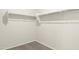 Walk-in closet with white shelving and carpeted floor at 5812 E Freesia Ln, San Tan Valley, AZ 85140