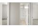 Hallway leading to a bathroom with a standing shower and access to other rooms at 5812 E Freesia Ln, San Tan Valley, AZ 85140