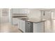 Spacious kitchen showcasing white cabinets, granite countertops, and stainless steel appliances at 5812 E Freesia Ln, San Tan Valley, AZ 85140