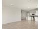 Open floor plan with kitchen view, neutral paint, tile flooring and ample natural light at 5812 E Freesia Ln, San Tan Valley, AZ 85140