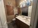 Bathroom featuring a vanity, a mirror, and a toilet at 7326 W Dreyfus Dr, Peoria, AZ 85381