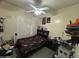 Small bedroom with a large bed and multiple storage options at 7326 W Dreyfus Dr, Peoria, AZ 85381