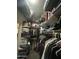 Walk-in closet showing racks of hanging and folded clothes at 7326 W Dreyfus Dr, Peoria, AZ 85381