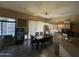 Bright dining area featuring modern lighting, tile floors, and direct access to the backyard at 7326 W Dreyfus Dr, Peoria, AZ 85381