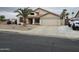 Welcoming home with desert landscaping, tile roof, and a spacious two-car garage with ample parking at 7326 W Dreyfus Dr, Peoria, AZ 85381